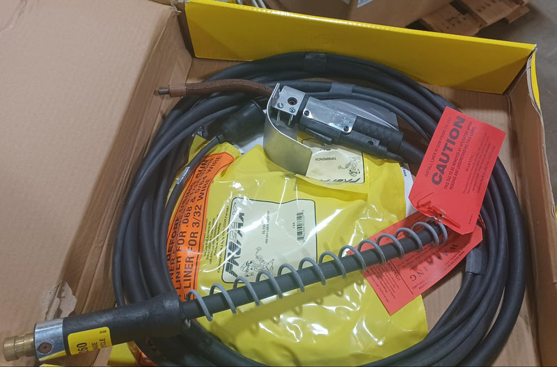 A Profax 1260-15 MIG welding gun with a 15' 5/64' wire size, new and surplus, in its packaging.